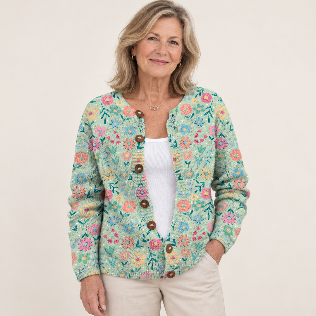 Foxfield | Pastel Floral Pattern Knit Cardigan with Wooden Buttons worn by a mature woman on a clean background