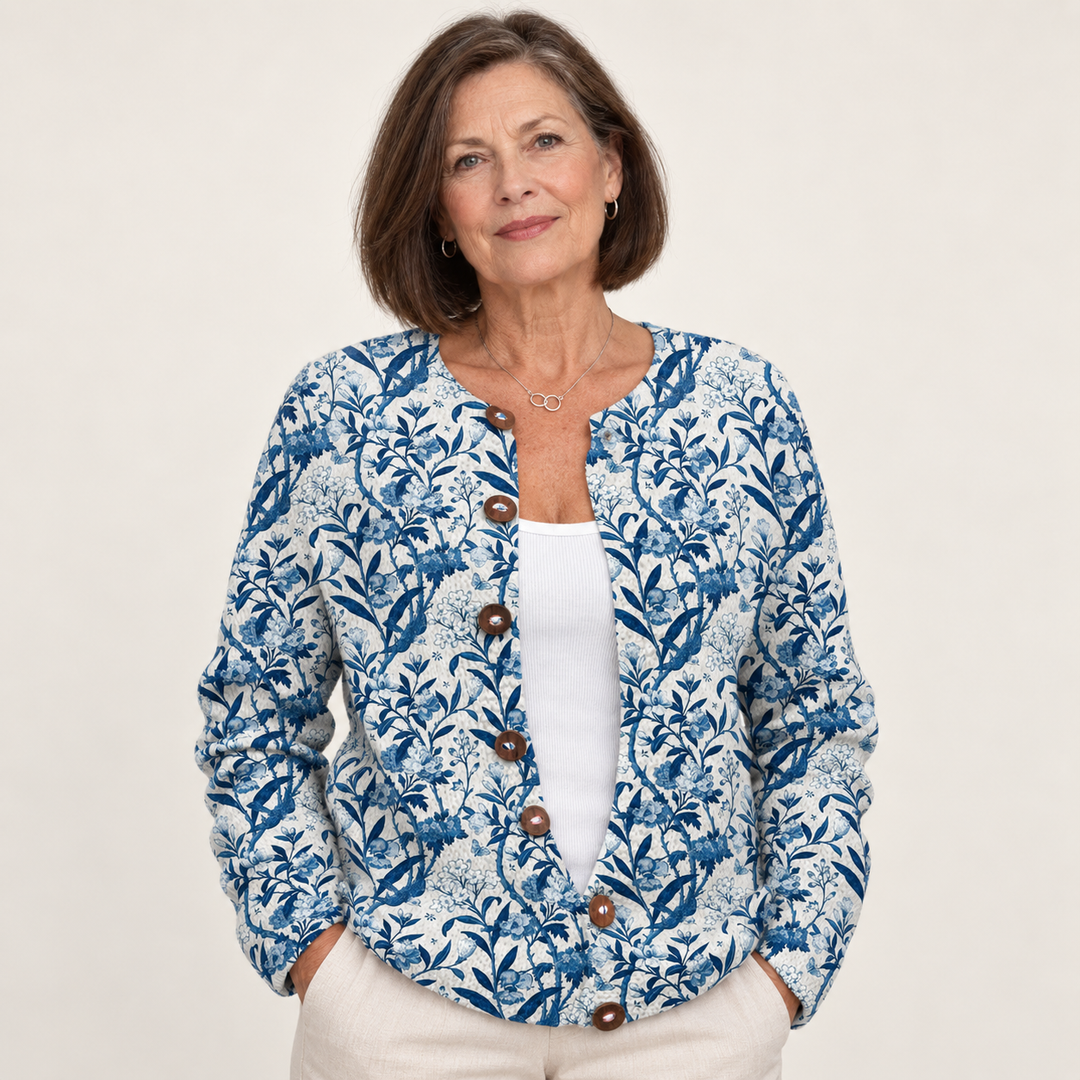 Tiverly | Indigo Botanical Knit Cardigan with Five Buttons worn by a mature woman on a clean background