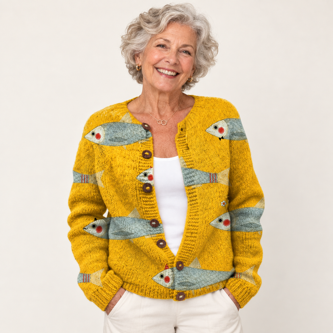 Anouk | Golden Knit Cardigan with Fish Print and Round Buttons worn by a mature woman on a clean background