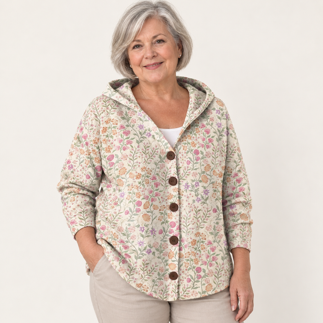 Quitterie Floral Garden Hooded Cardigan worn by a mature woman on a clean studio background