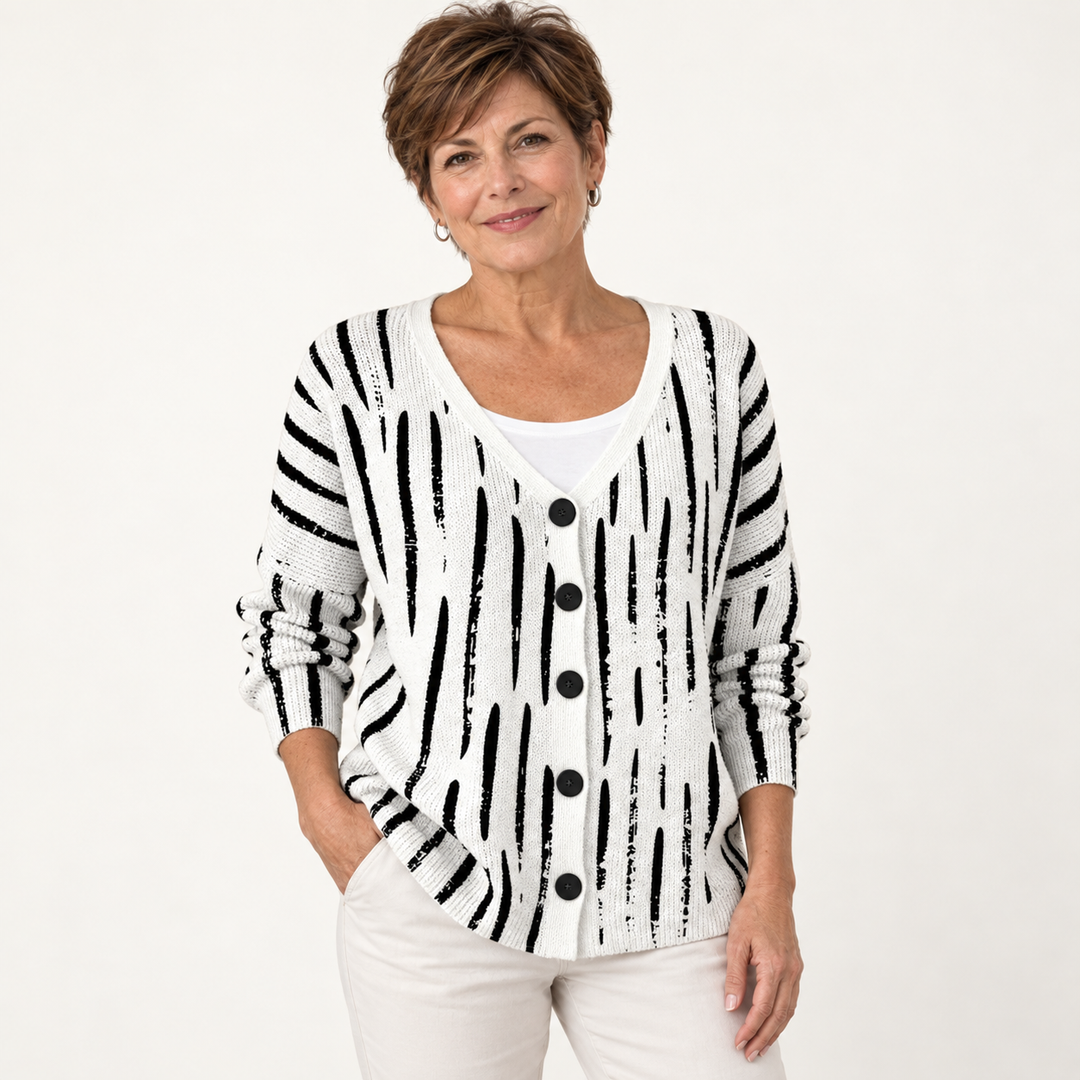 Violette Black-and-White Graphic Cardigan worn by a mature woman on a clean studio background