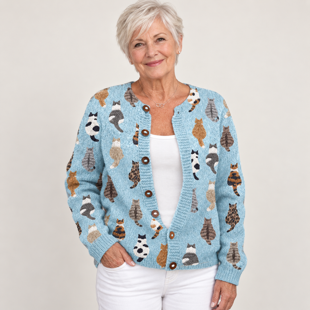 Charlotte cardigan in Blue, worn by a mature woman on a clean background