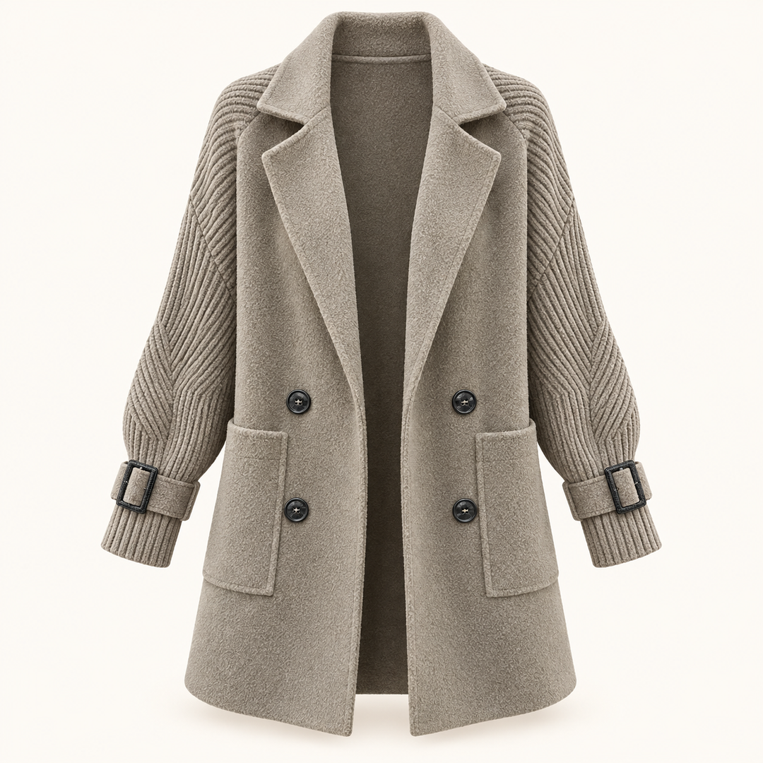 Women's double-breasted coat with knitted sleeves — isolated