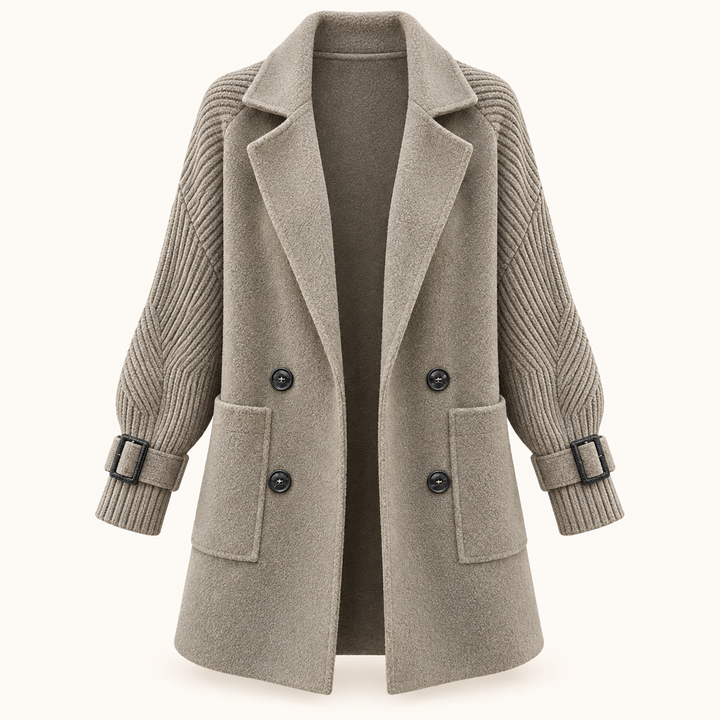 Women's double-breasted coat with knitted sleeves — isolated