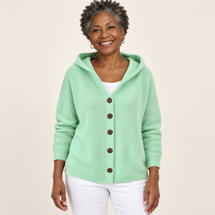 Teri cardigan in Green, worn by a mature woman on a clean background