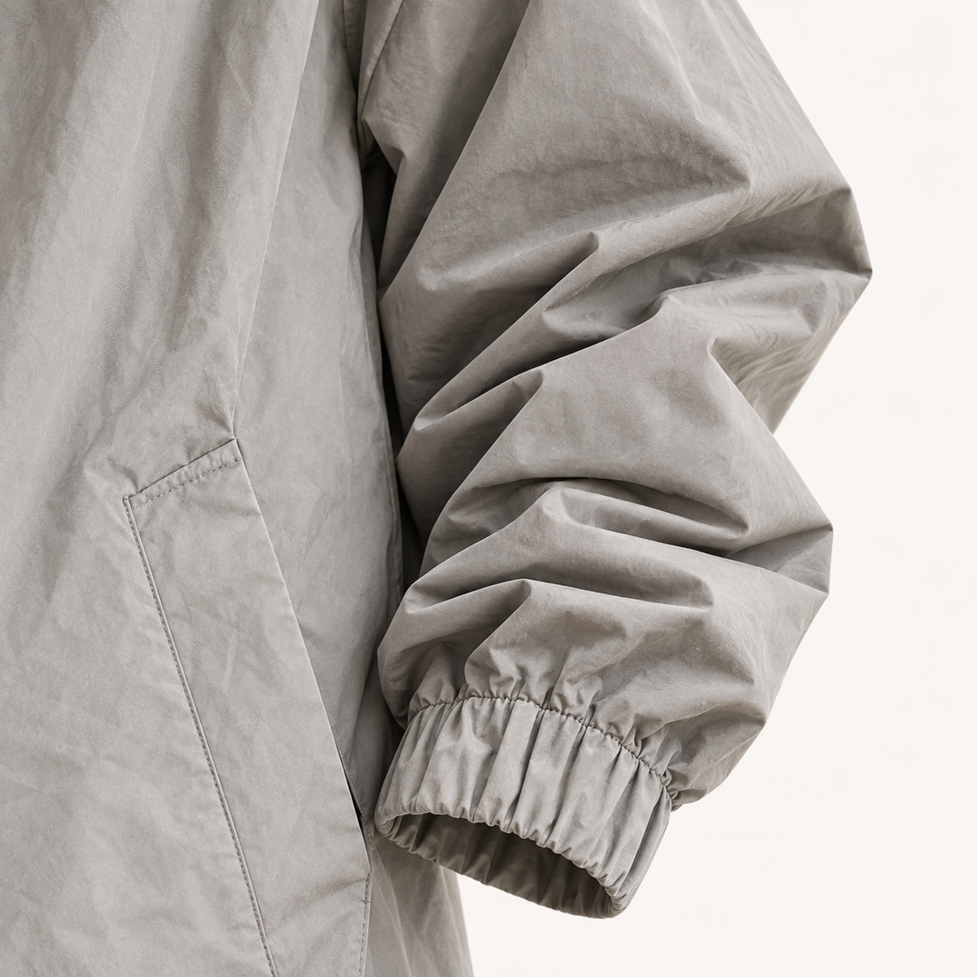 Hooded Raincoat — Grey — cuff and fabric detail