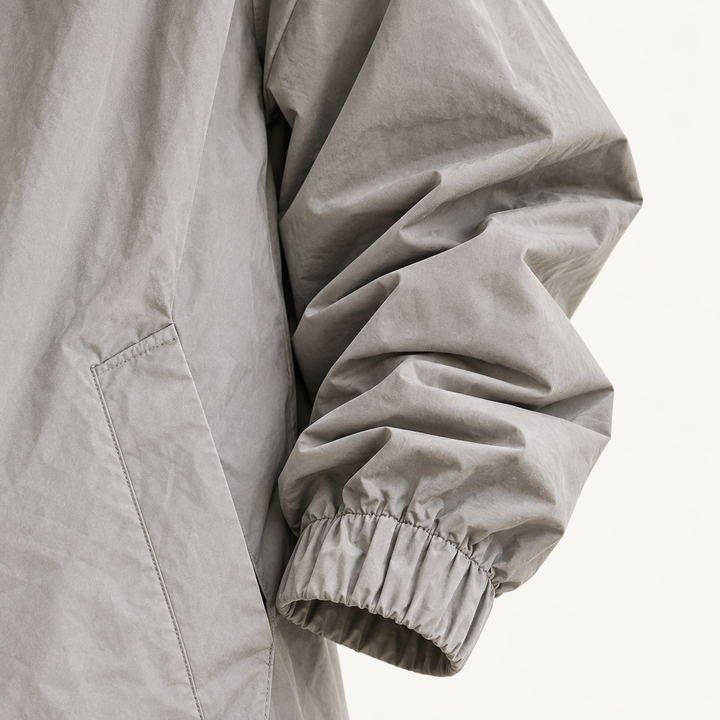 Hooded Raincoat — Grey — cuff and fabric detail