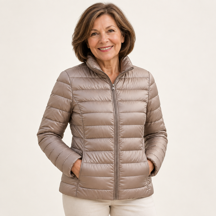 Ulla transitional padded jacket in Champagne worn by a mature woman, natural studio pose