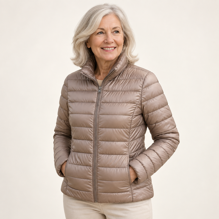 Ulla transitional padded jacket in Champagne worn by a mature woman, three-quarter view