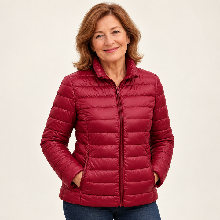 Ulla transitional padded jacket in Dark Red worn by a mature woman, natural studio pose