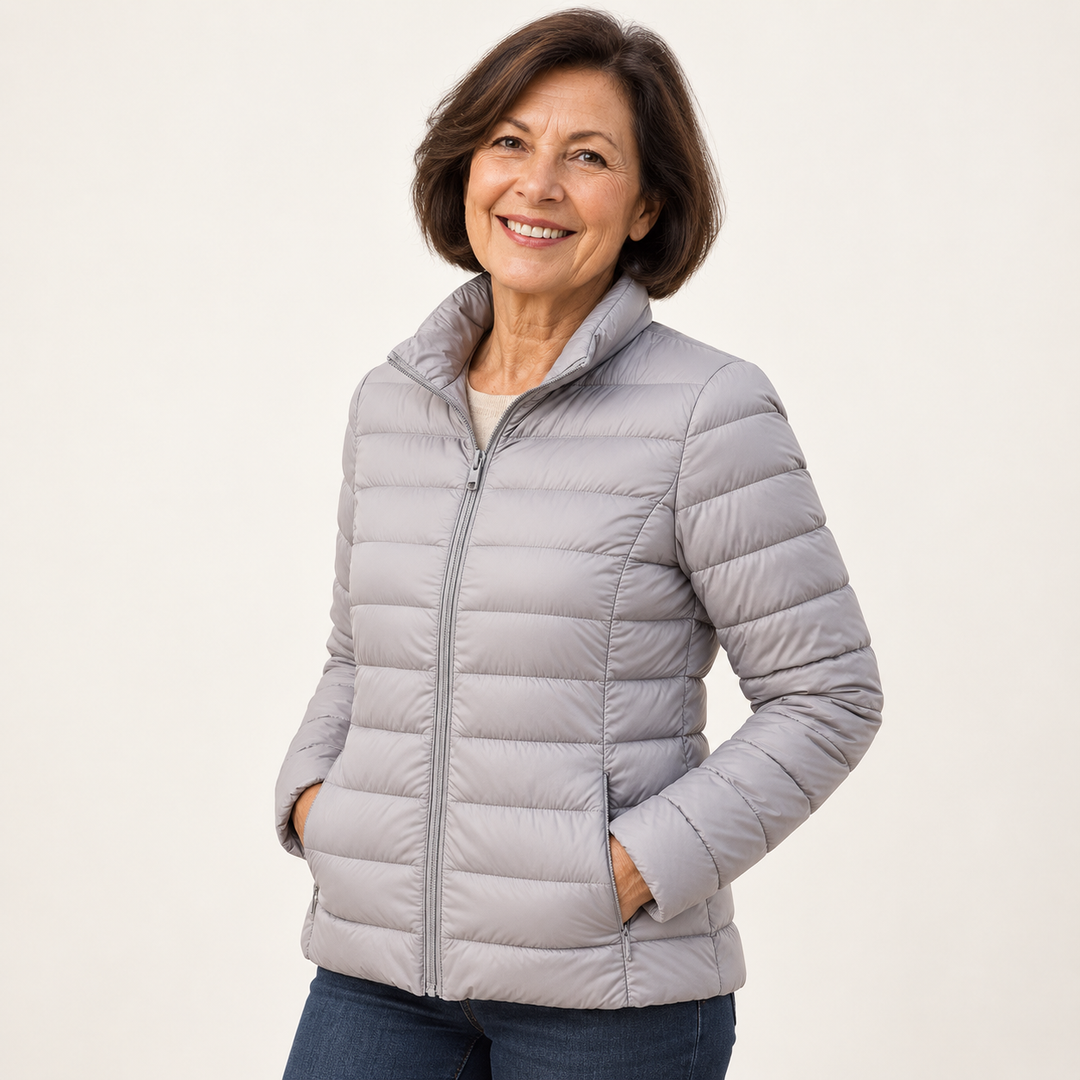 Ulla transitional padded jacket in Grey worn by a mature woman, three-quarter view