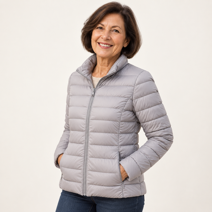 Ulla transitional padded jacket in Grey worn by a mature woman, three-quarter view