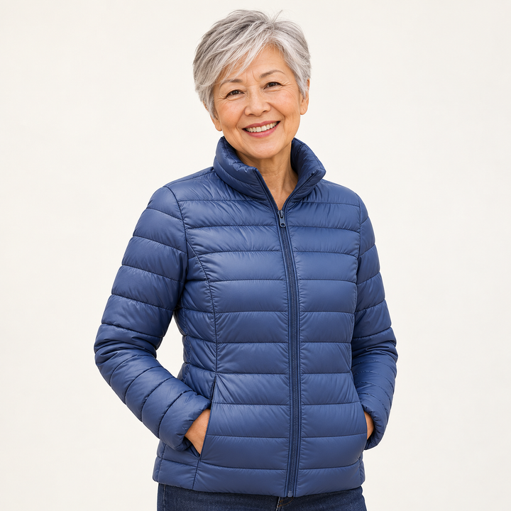 Ulla transitional padded jacket in Indigo worn by a mature woman, three-quarter view