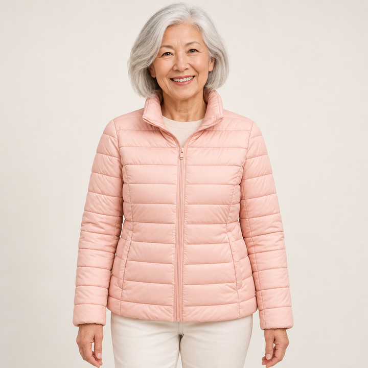 Ulla transitional padded jacket in Light Pink worn by a mature woman, front view