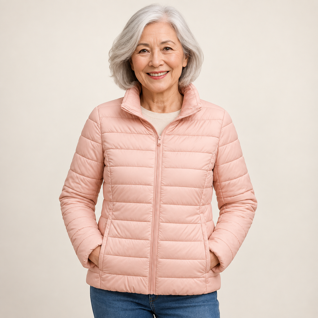 Ulla transitional padded jacket in Light Pink worn by a mature woman, natural studio pose