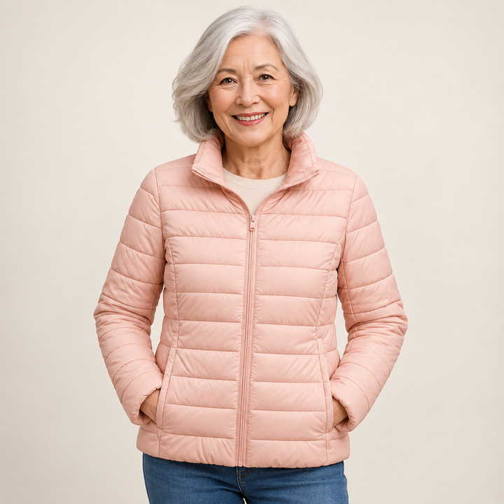 Ulla transitional padded jacket in Light Pink worn by a mature woman, natural studio pose