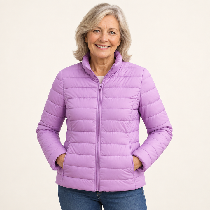 Ulla transitional padded jacket in Lilac worn by a mature woman, natural studio pose