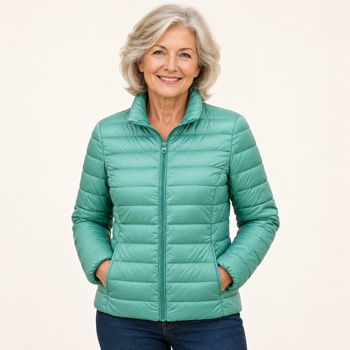 Ulla transitional padded jacket in Mint Green worn by a mature woman, natural studio pose