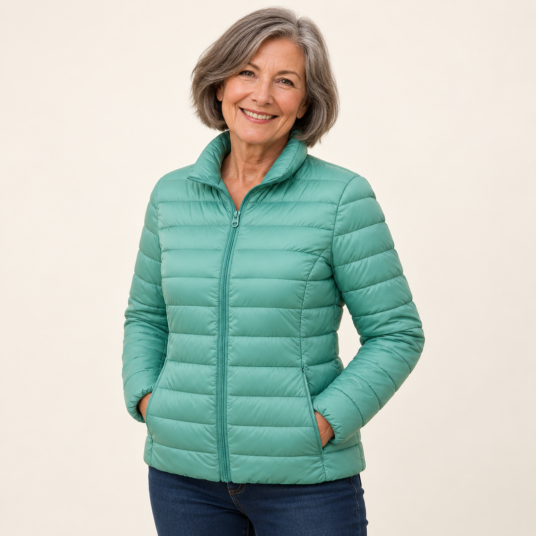 Ulla transitional padded jacket in Mint Green worn by a mature woman, three-quarter view