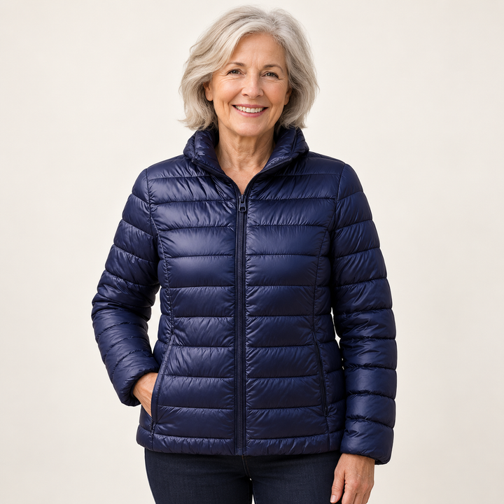 Ulla transitional padded jacket in Navy Blue worn by a mature woman, natural studio pose