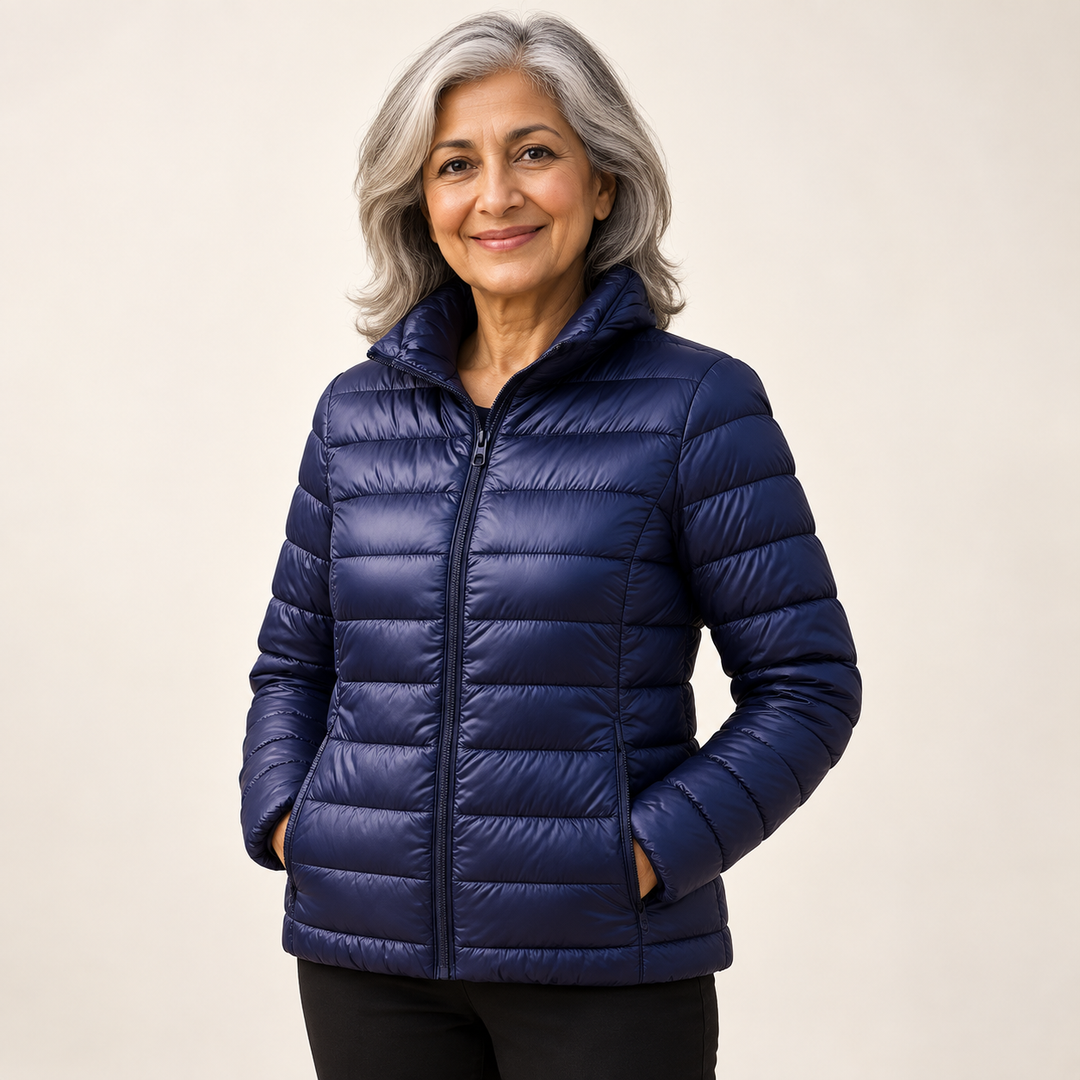 Ulla transitional padded jacket in Navy Blue worn by a mature woman, three-quarter view