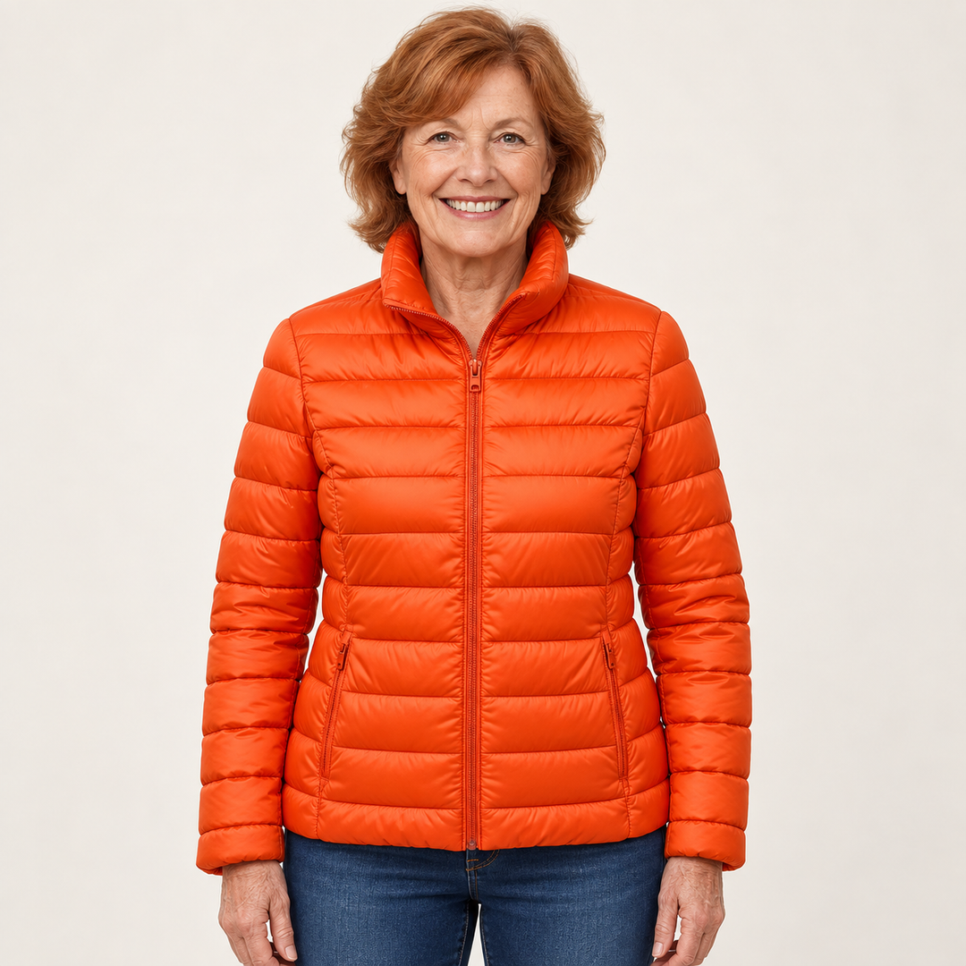 Ulla transitional padded jacket in Orange worn by a mature woman, front view
