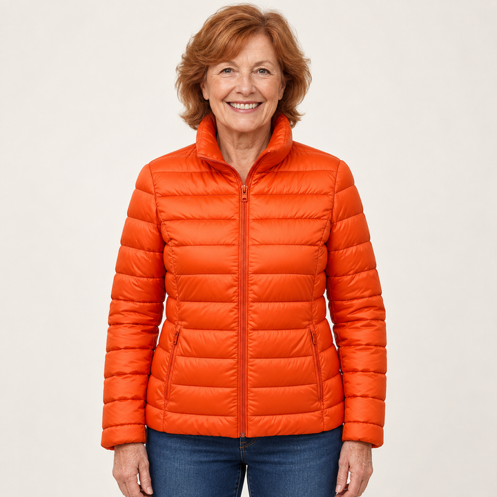 Ulla transitional padded jacket in Orange worn by a mature woman, front view