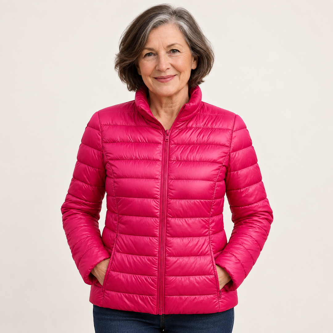 Ulla transitional padded jacket in Pink worn by a mature woman, natural studio pose