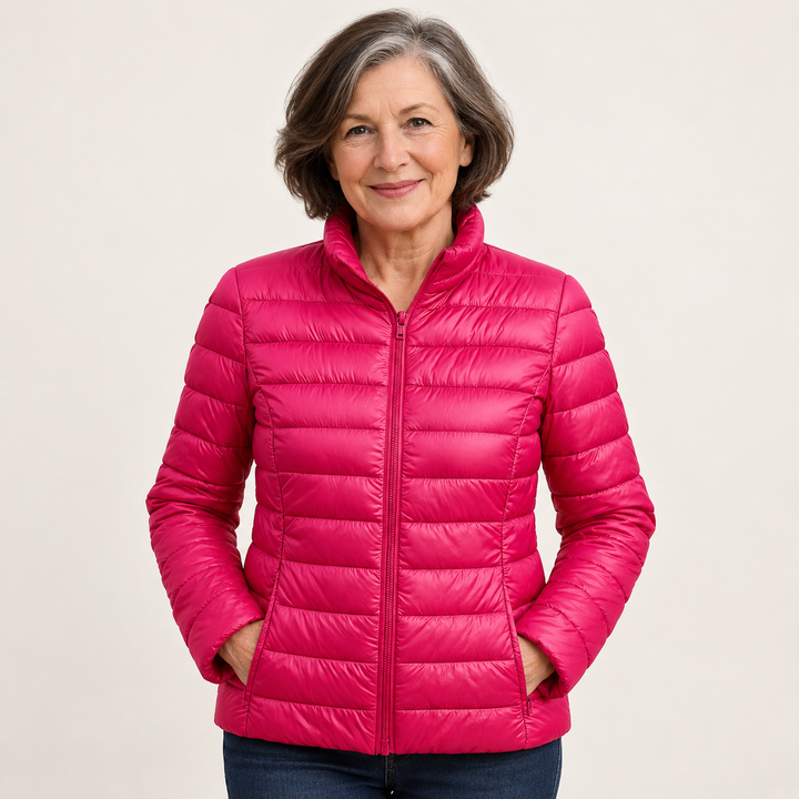 Ulla transitional padded jacket in Pink worn by a mature woman, natural studio pose