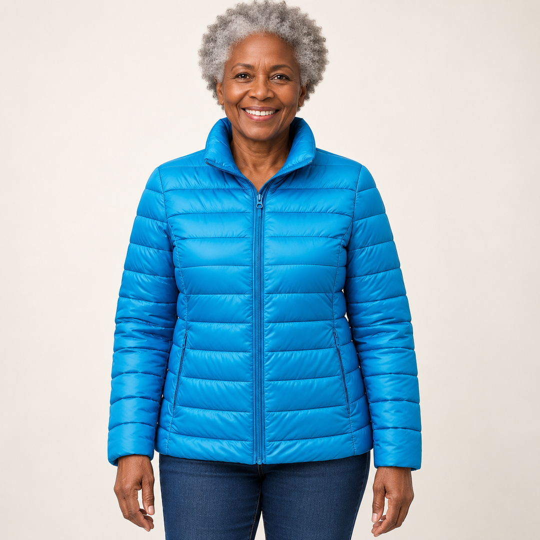 Ulla transitional padded jacket in Sky Blue worn by a mature woman, front view