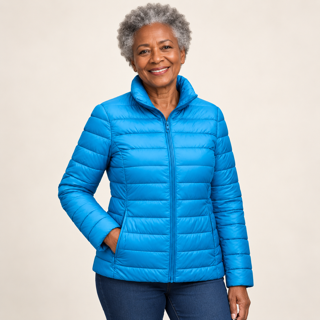 Ulla transitional padded jacket in Sky Blue worn by a mature woman, three-quarter view