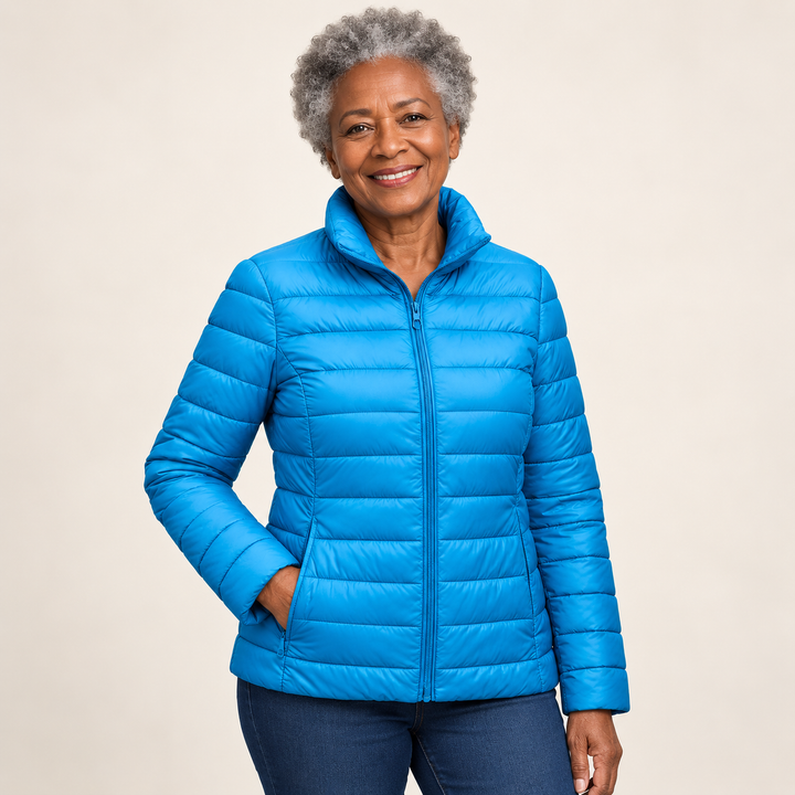 Ulla transitional padded jacket in Sky Blue worn by a mature woman, three-quarter view