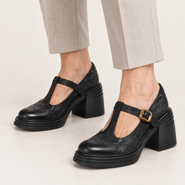 Vera T-strap shoes in Black worn close-up